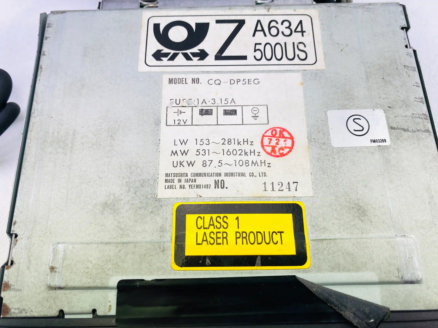 Panasonic CQ-DP5EG model label showing Class 1 Laser Product marking