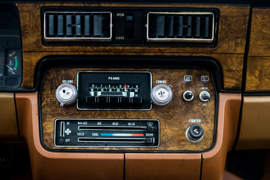 Vintage car radio in wooden dashboard