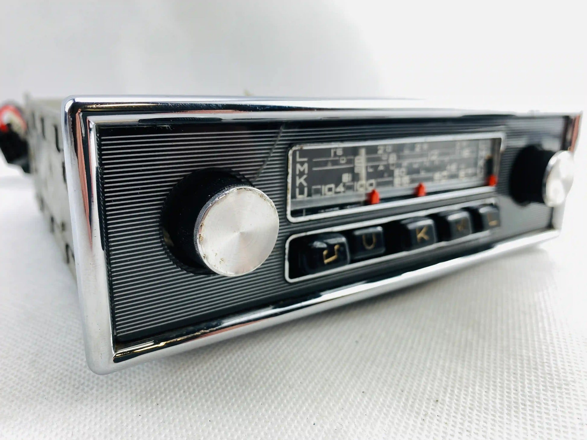 1960s Blaupunkt Essen FM classic car radio left angled view showing chrome volume knob
