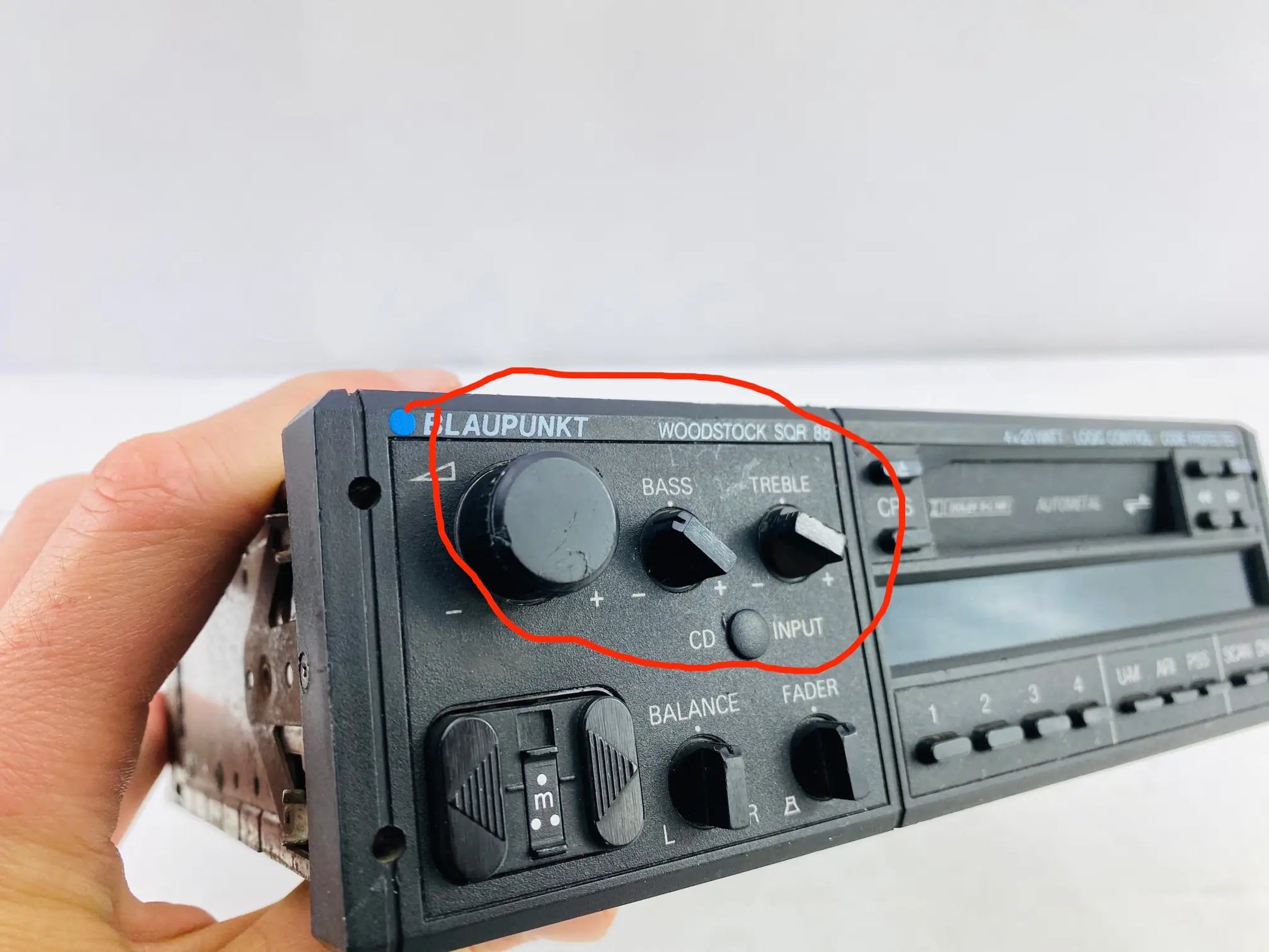 1980s Blaupunkt Woodstock SQR 88 car cassette radio front left controls showing volume bass and treble knobs