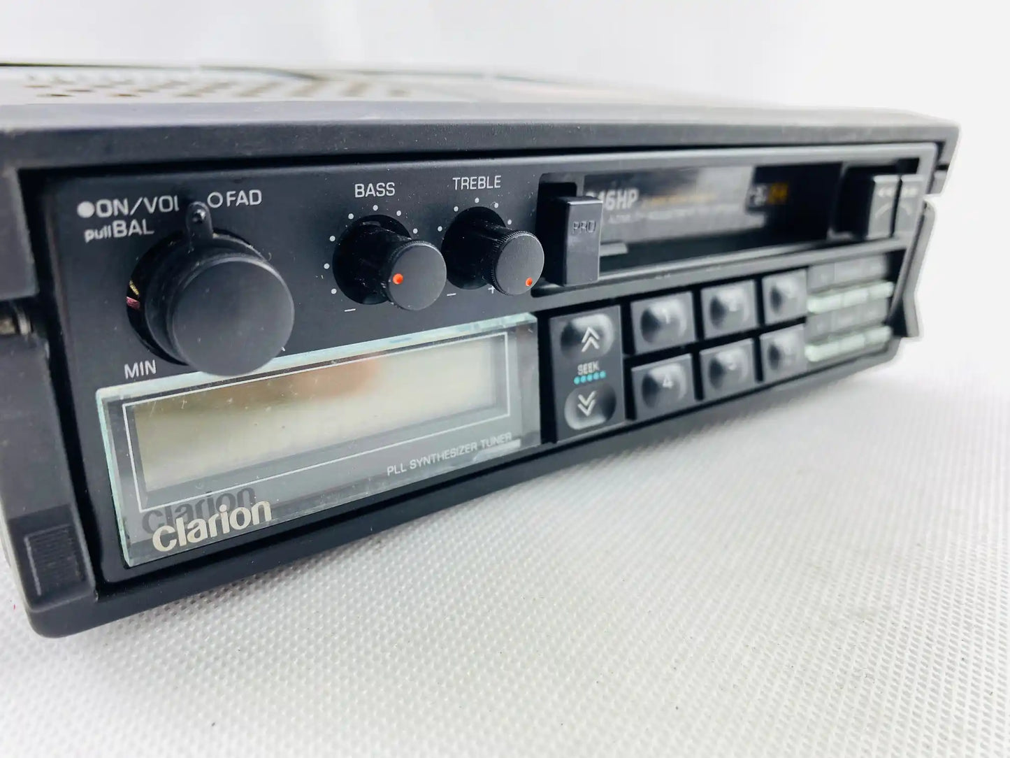 1980s Clarion 946HP car cassette radio player bass treble and volume controls close up