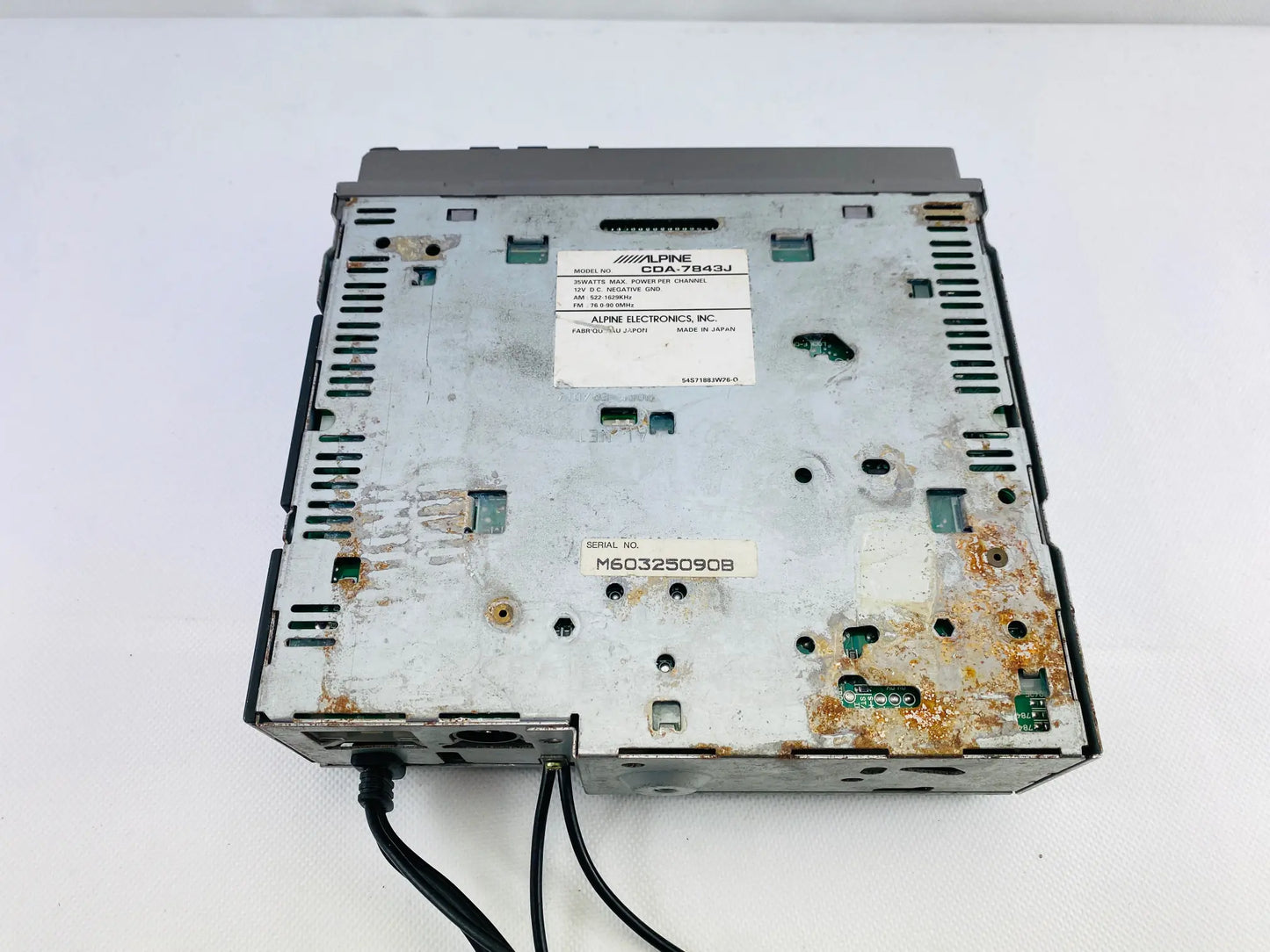Alpine CDA-7843J rear top casing showing surface corrosion