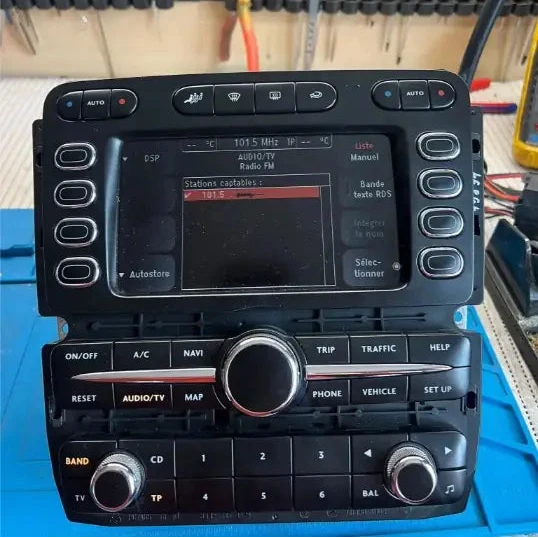 Bentley Continental GT multimedia navigation unit on the workshop bench during repair