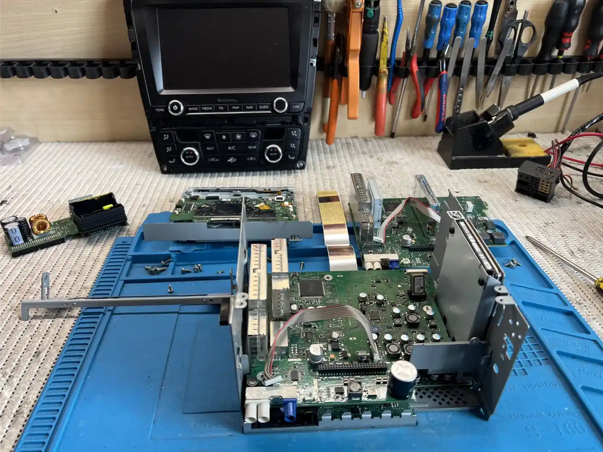 Bentley RNS 810 multimedia unit dismantled for internal electronic repair