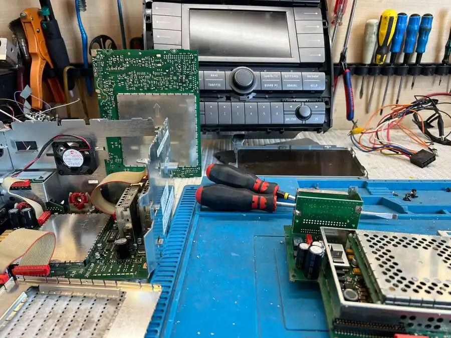 VW Phaeton multimedia system undergoing board level repair in professional electronics workshop